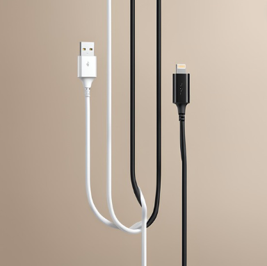 The image depicts two cables against a beige background. On the left, there’s a white USB cable with a standard USB-A connector at the top end. On the right, a black cable features a smaller, reversible USB-C connector. Both cables form gentle loops and hang in an aesthetically pleasing arrangement. The contrast between the white and black cables adds visual interest. This image could be relevant for discussions on technology, connectivity, or electronic accessories.